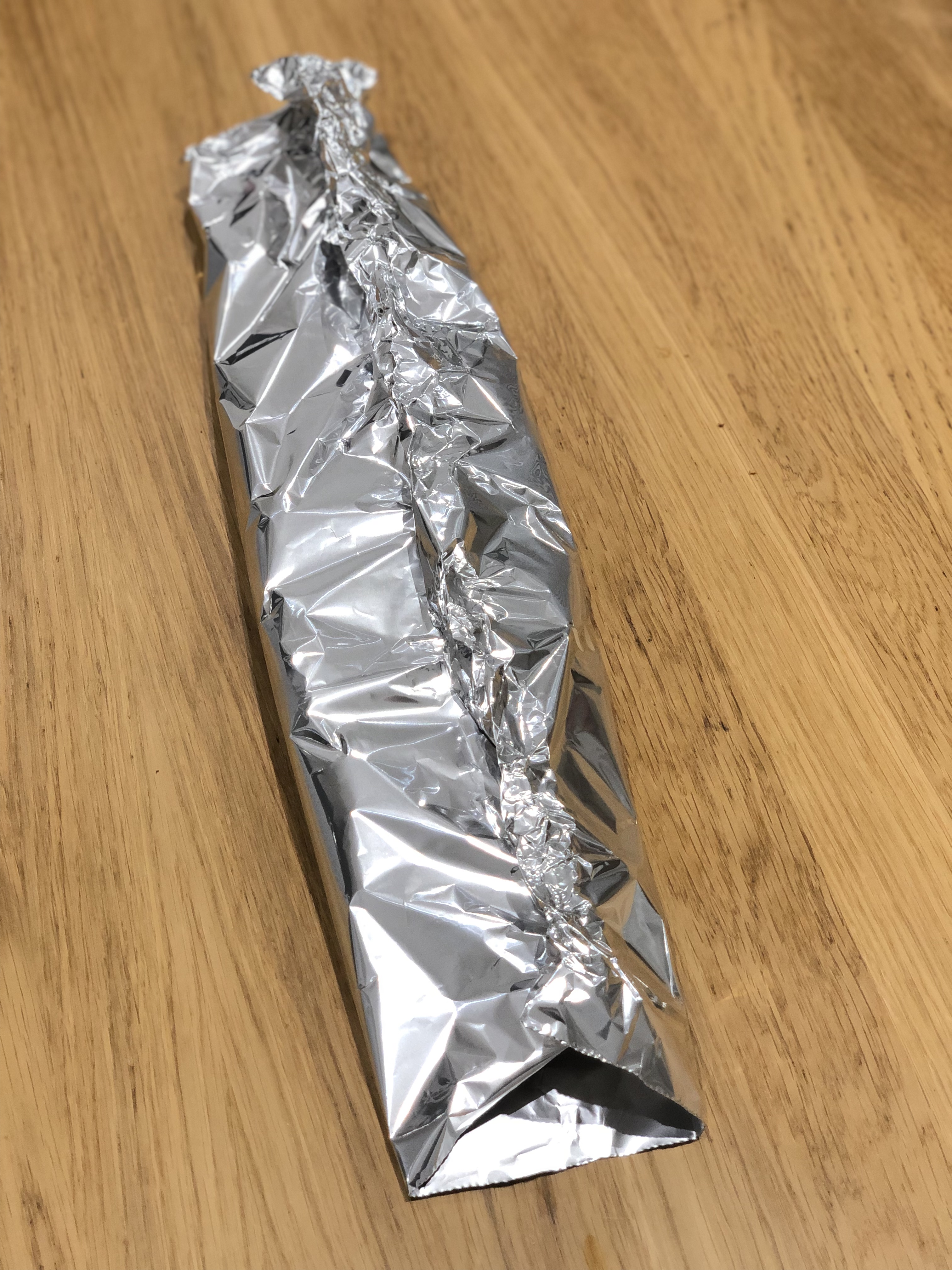 fold the foil together tightly pressing long ways, ensuring no gaps